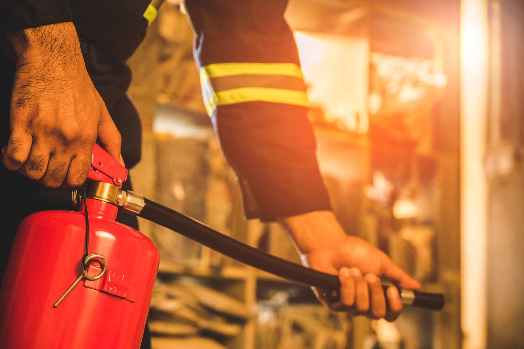 Fireman Using Fire Extinguisher